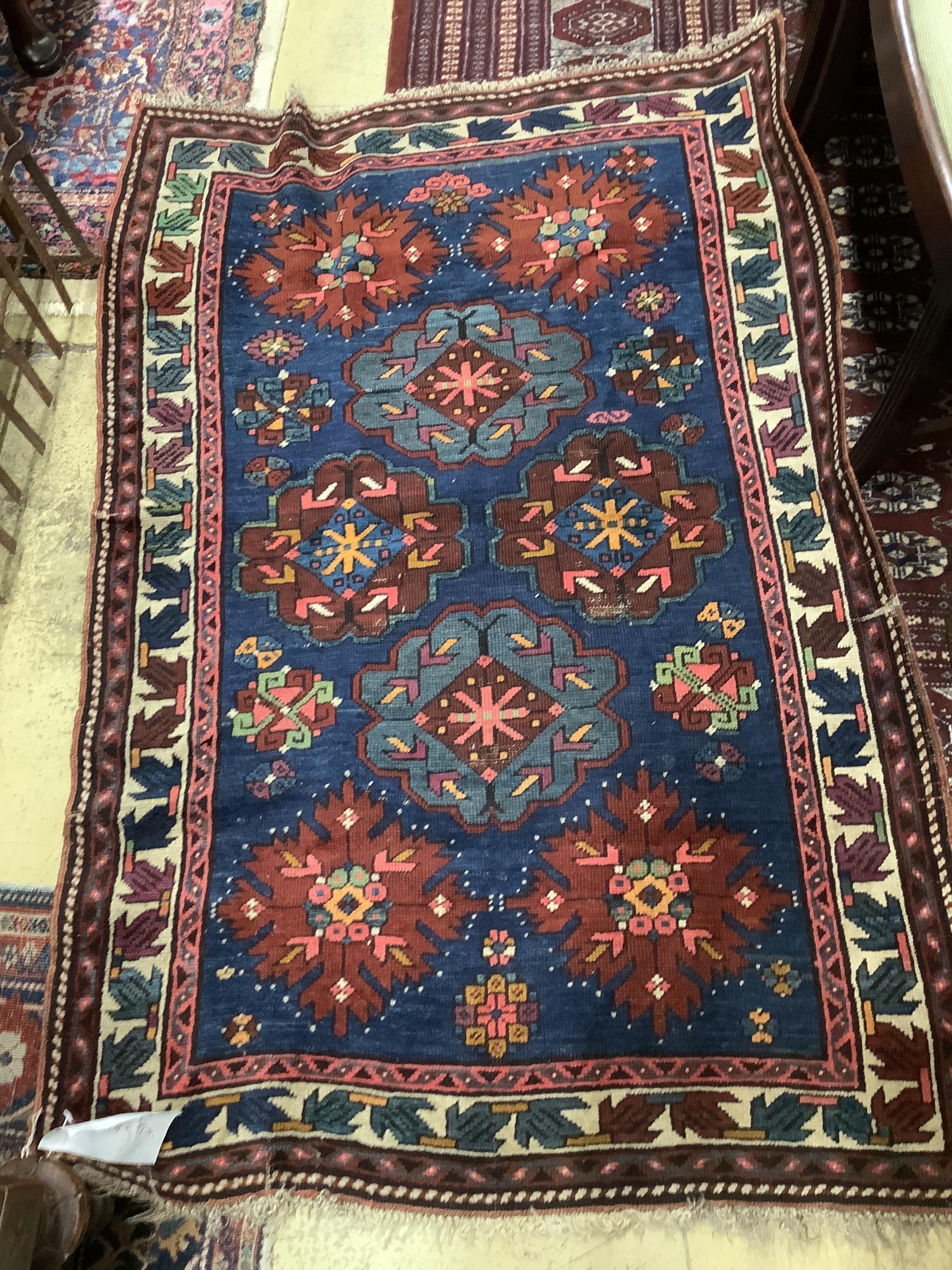 A Caucasian Seychour blue ground rug, 144 x 98cm